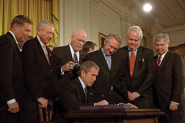 Signing of the PATRIOT ACT, 2001, Eric Draper, photograph, public domain by the Executive Office of the President.